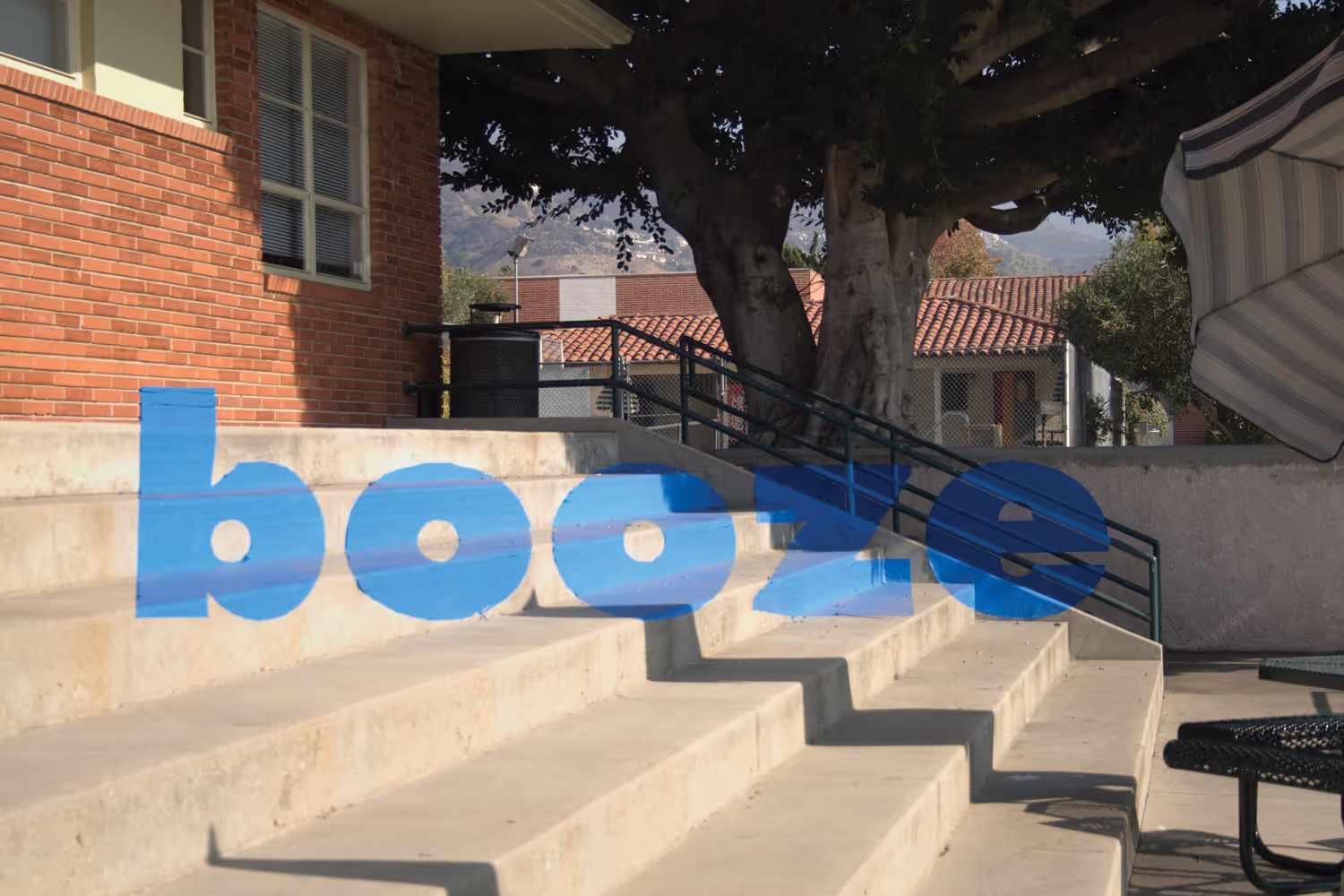 Anamorphic typography project showing the word "booze" seemingly floating in space. School project.