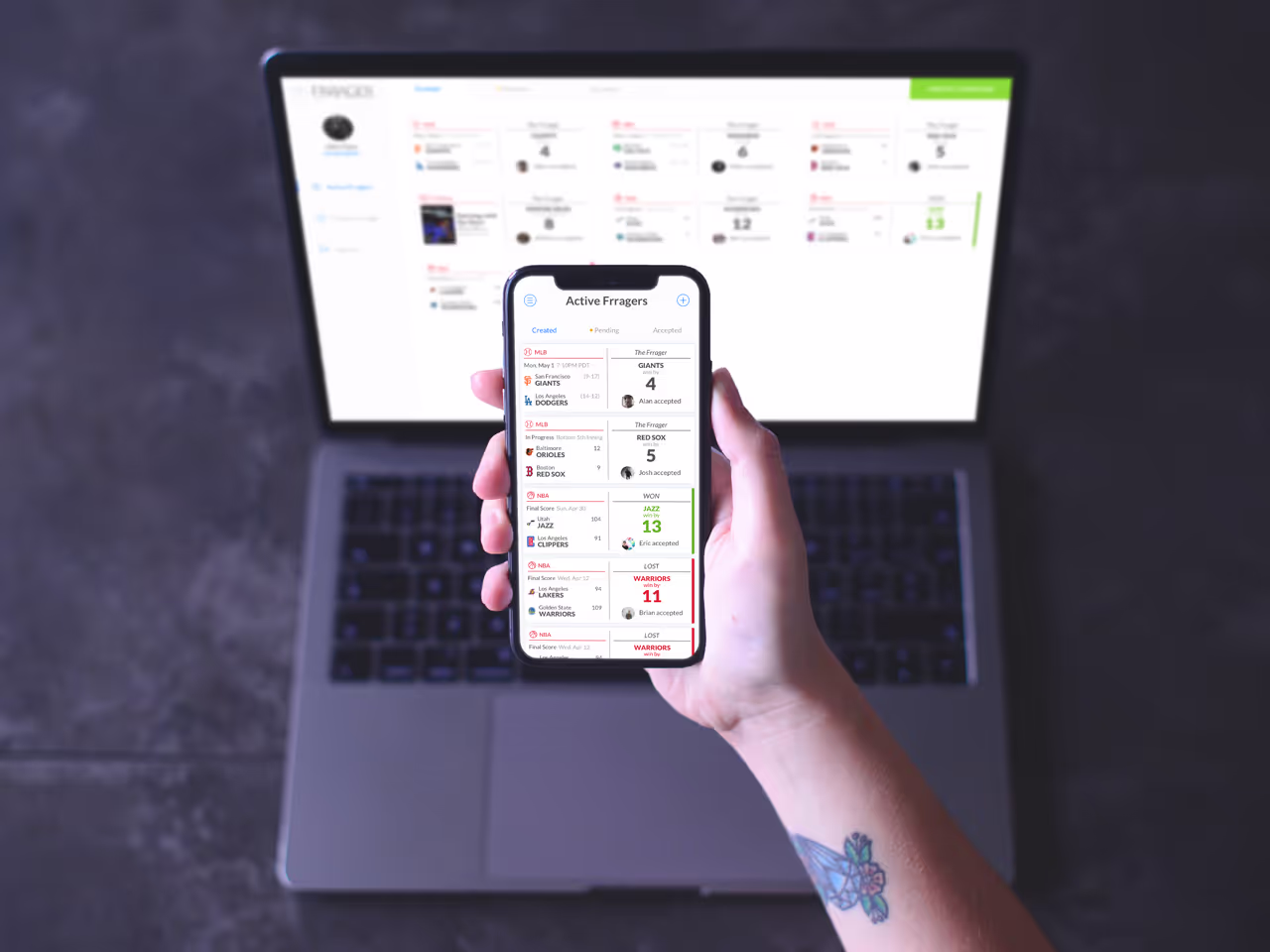 An open laptop screen and hand holding a phone in front of it, both showing screenshots of a sports betting app called "Frrager."